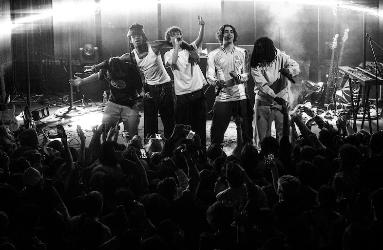 WHATMORE: From LaGuardia’s Halls to Coachella’s Stages, a Genre-Bending Collective’s Ascent